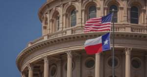 Zoomed in on Texas Capitol Building in Austin Texas and US Flag Out Front
